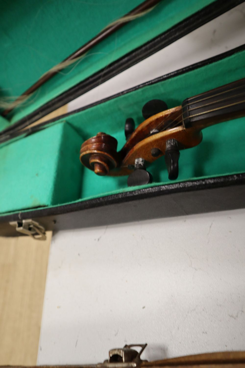 A violin, with 35.5cm back, with bow and some accessories, in case, together with Parrot trombone, cased